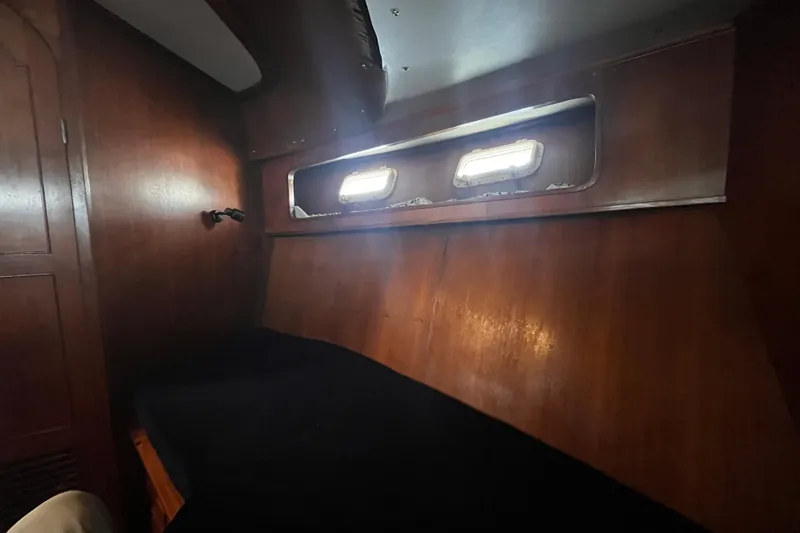 Slide: The Image of Interior cabin of 1986 Jefferson 42 SE Sundeck Motor Yacht with wooden paneling. - 42