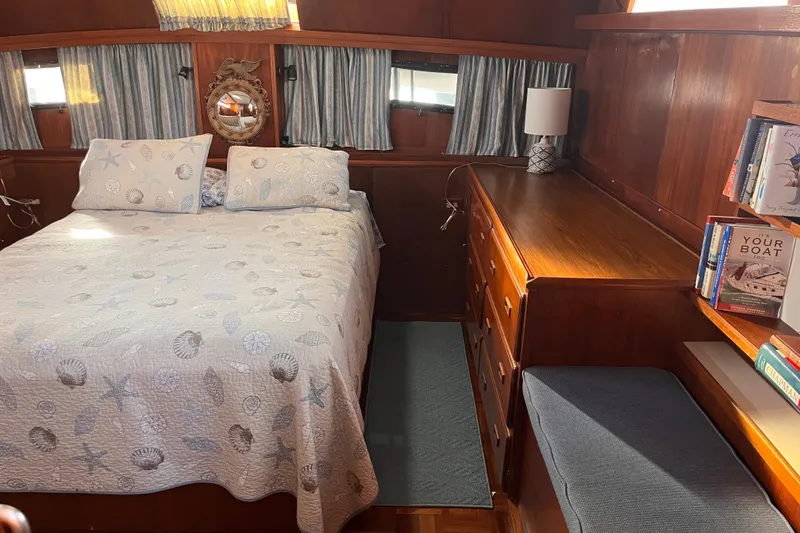 Slide: The Image of Cozy bedroom in 1986 Jefferson 42 SE Sundeck Motor Yacht with nautical decor. - 44