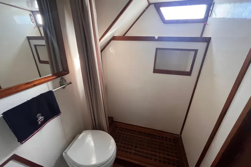 Slide: The Image of Bathroom interior of 1986 Jefferson 42 SE Sundeck Motor Yacht with shower and toilet. - 46
