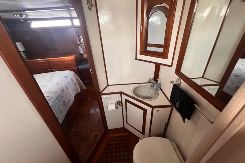 Slide: The Image of Bathroom and bedroom interior of 1986 Jefferson 42 SE Sundeck Motor Yacht. - 48