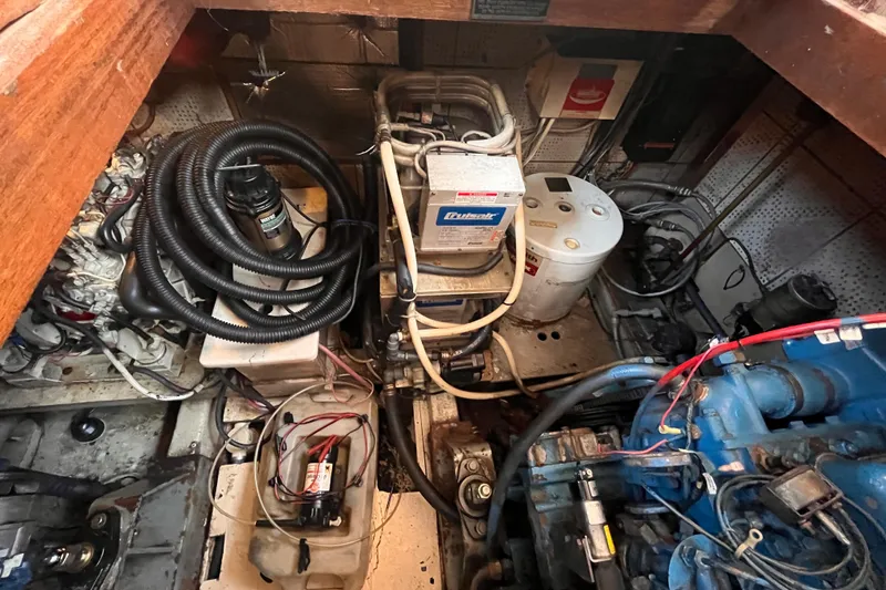 Slide: The Image of Engine room of 1986 Jefferson 42 SE Sundeck Motor Yacht with visible components and wiring. - 56