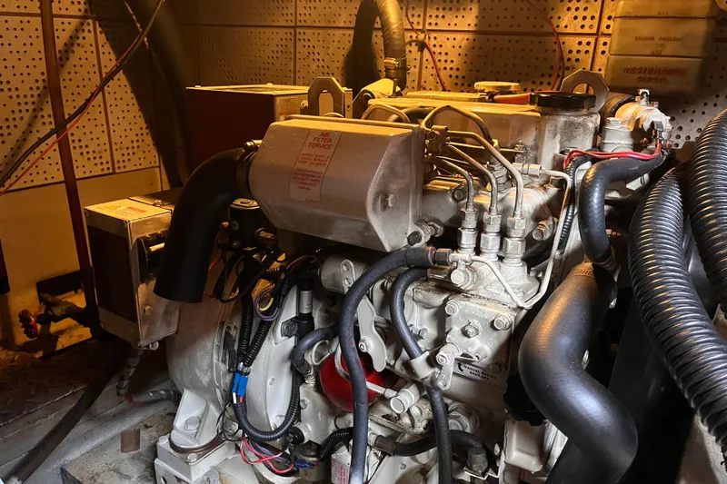 Slide: The Image of Engine room of 1986 Jefferson 42 SE Sundeck Motor Yacht, showcasing detailed machinery. - 57