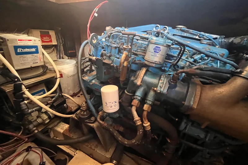 Slide: The Image of Engine room of 1986 Jefferson 42 SE Sundeck Motor Yacht with visible components. - 61