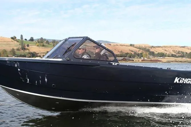 The Image of 2026 KingFisher 2025 Escape boat cruising on a scenic lake. - 1