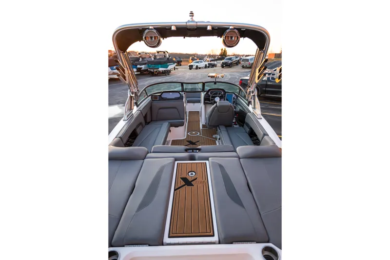 Slide: The Image of 2022 MasterCraft XStar boat interior with sleek seating and modern design. - 10