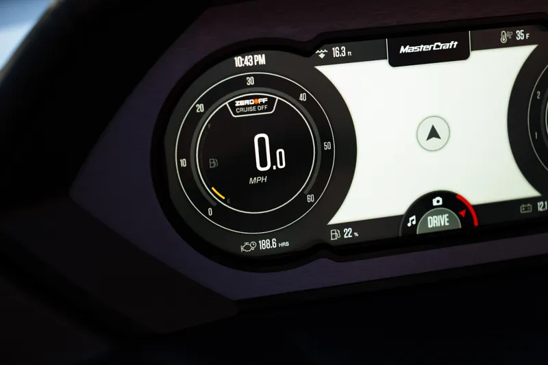 Slide: The Image of 2022 MasterCraft XStar dashboard display showing speedometer and navigation. - 17