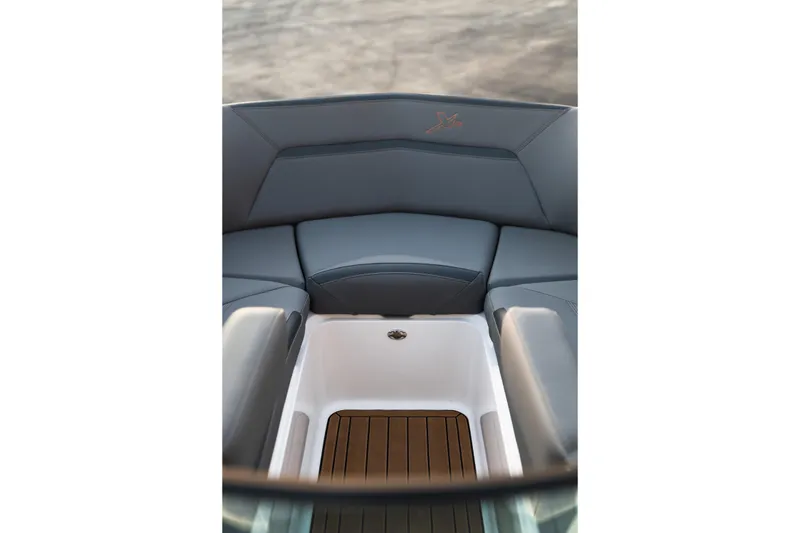 Slide: The Image of Interior seating of 2022 MasterCraft XStar boat with sleek design and storage compartment. - 32