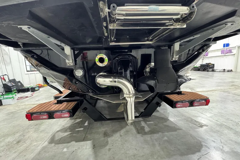 Slide: The Image of 2023 Nautique Super Air Nautique S25 boat on trailer in showroom. - 4