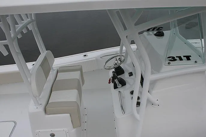 Slide: The Image of Manufacturer Provided Image: 2026 Cape Horn 31 T boat interior with steering wheel and seating. - 10