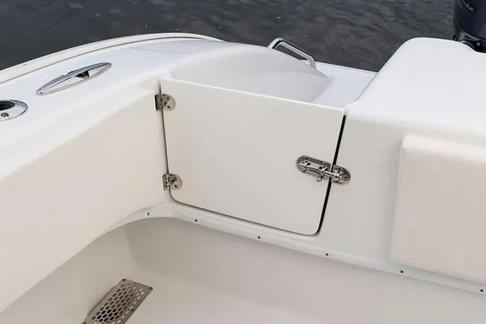 Slide: The Image of Manufacturer Provided Image: 2026 Cape Horn 31 T boat interior, featuring a white storage compartment with metal hinges. - 16