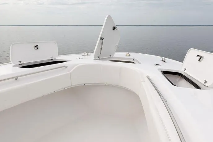 Slide: The Image of Manufacturer Provided Image: 2026 Cape Horn 31 T boat with open storage compartments on calm water. - 7