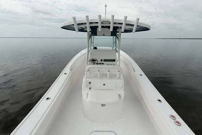 Slide: The Image of Manufacturer Provided Image: 2026 Cape Horn 31 T boat on calm water, showcasing sleek design and spacious deck. - 8