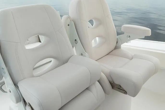 Slide: The Image of Manufacturer Provided Image: 2026 Cape Horn 31 T boat seats, white leather, ergonomic design, on calm water. - 12