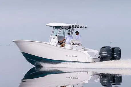 Slide: The Image of Manufacturer Provided Image: 2026 Cape Horn 31 T boat cruising on calm water with twin engines. - 2