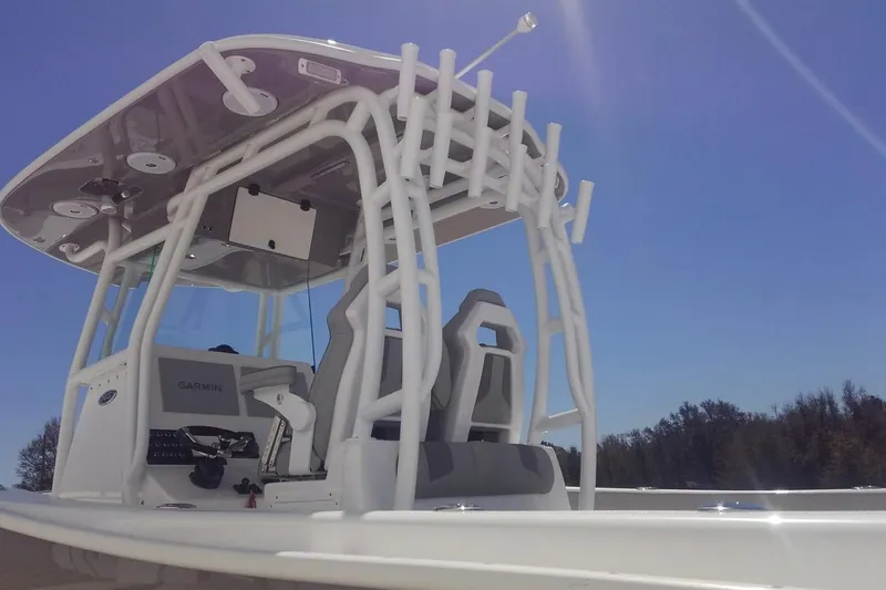 Slide: The Image of Manufacturer Provided Image: 2026 Cape Horn 34 XS boat with modern helm and seating under clear blue sky. - 3