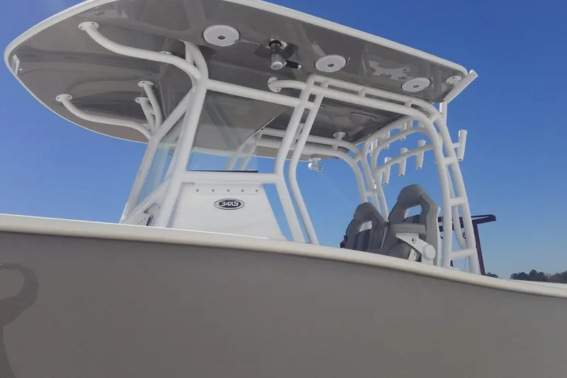 Slide: The Image of Manufacturer Provided Image: 2026 Cape Horn 34 XS boat with T-top and seating, under clear blue sky. - 4