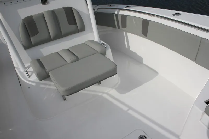 Slide: The Image of Manufacturer Provided Image: 2026 Cape Horn 34 XS boat interior with gray cushioned seating. - 5