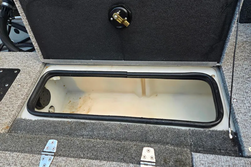 Slide: The Image of Open storage compartment in 2020 Alumacraft Voyageur 175 Sport boat. - 14