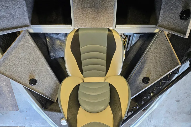 Slide: The Image of 2020 Alumacraft Voyageur 175 Sport boat interior with storage compartments and seat. - 19