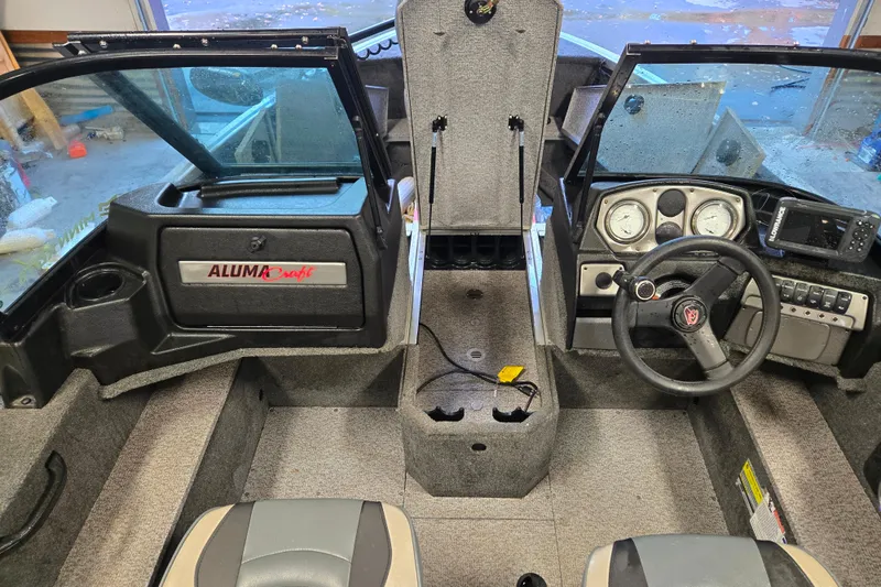 Slide: The Image of Interior of 2020 Alumacraft Voyageur 175 Sport boat with steering wheel and dashboard. - 4