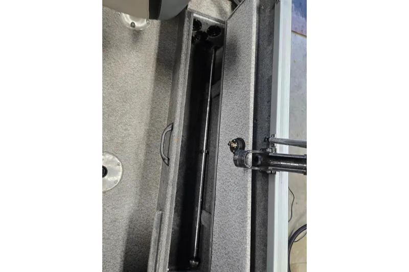 Slide: The Image of 2020 Alumacraft Voyageur 175 Sport interior storage compartment detail. - 5