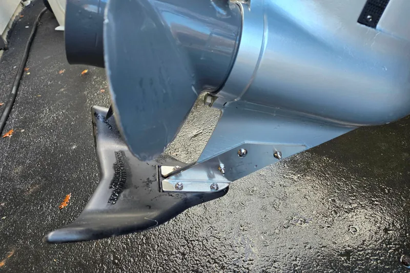 Slide: The Image of Close-up of Alumacraft Voyageur 175 Sport 2020 boat propeller on wet surface. - 9