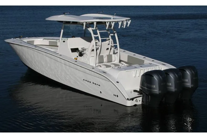 Slide: The Image of Manufacturer Provided Image: 2026 Cape Horn 36 XS boat with triple outboard engines on calm water. - 4