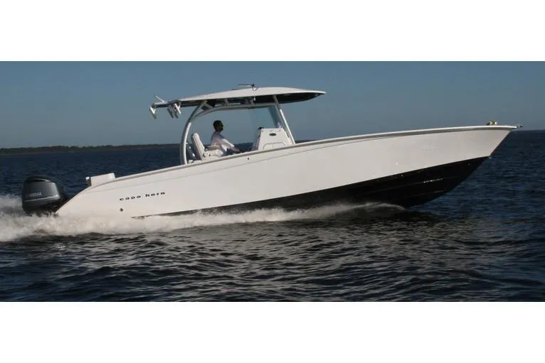 Slide: The Image of Manufacturer Provided Image: 2026 Cape Horn 36 XS boat cruising on open water, side view. - 1