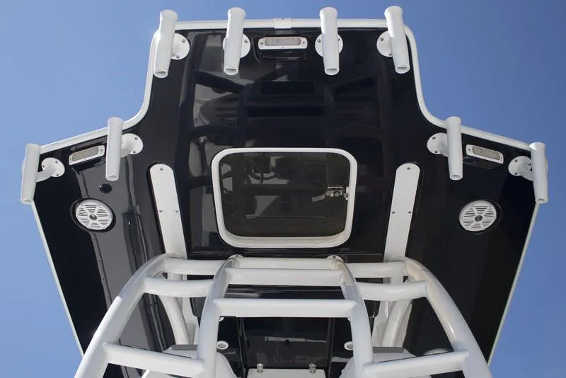 Slide: The Image of Manufacturer Provided Image: 2026 Cape Horn 36 XS boat roof with rod holders and speakers against blue sky. - 6