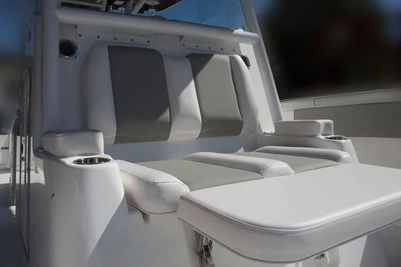 Slide: The Image of Manufacturer Provided Image: 2026 Cape Horn 36 XS boat interior with cushioned seating and cup holders. - 9