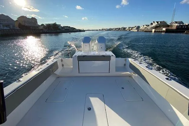 Slide: The Image of Manufacturer Provided Image: 2026 Cape Horn 39 T boat cruising on a sunny waterway with scenic coastal views. - 4