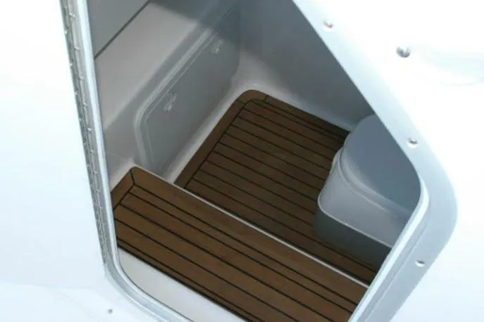 Slide: The Image of Manufacturer Provided Image: 2026 Cape Horn 32 T interior with wooden flooring and compact design. - 10