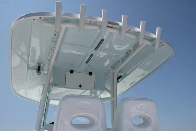 Slide: The Image of Manufacturer Provided Image: Cape Horn 32 T 2026 boat's T-top with rod holders against clear sky. - 7
