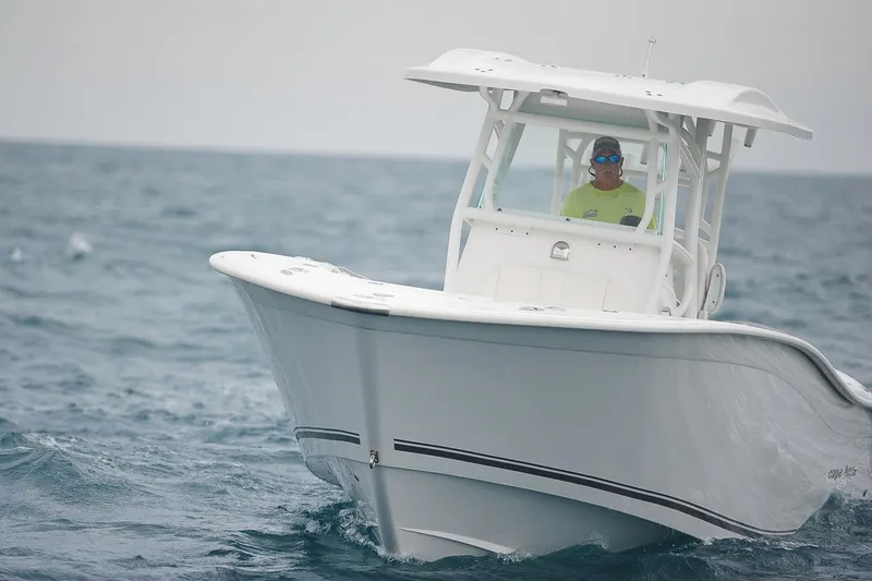 Slide: The Image of Manufacturer Provided Image: 2026 Cape Horn 32 T boat navigating through ocean waters. - 2