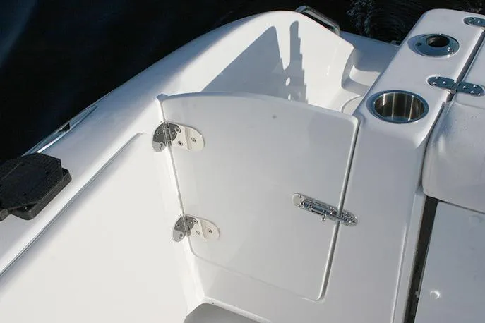 Slide: The Image of Manufacturer Provided Image: 2026 Cape Horn 32 T boat interior with open hatch and cup holders. - 9