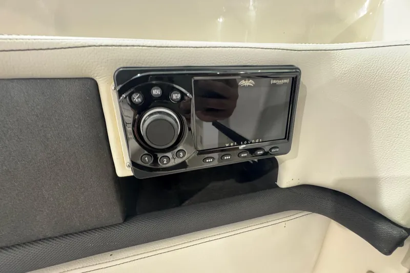 Slide: The Image of Control panel of a 2015 Sea Ray 250 SLX boat with audio system. - 12
