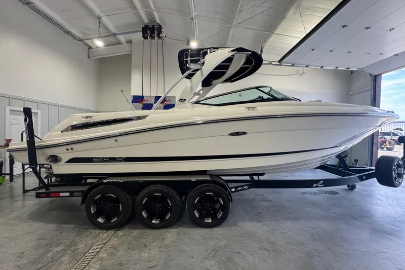 Slide: The Image of 2015 Sea Ray 250 SLX boat on trailer in a garage setting. - 5