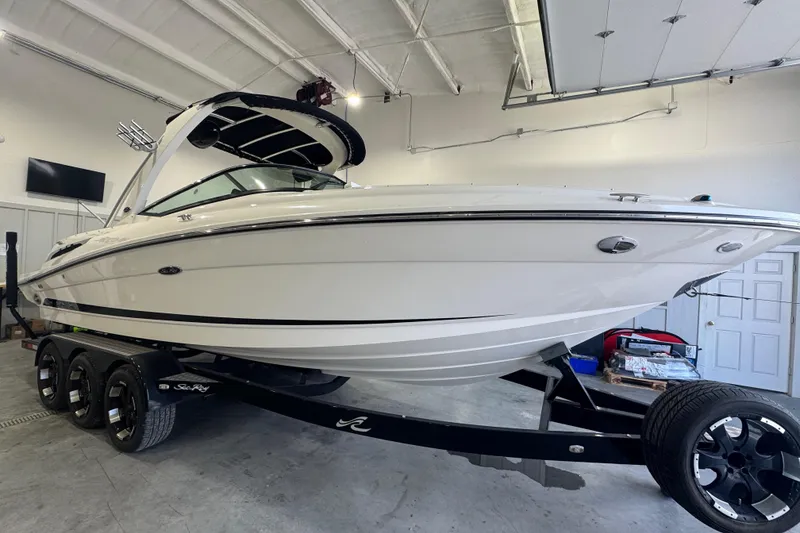 Slide: The Image of 2015 Sea Ray 250 SLX boat on trailer in indoor storage facility. - 6