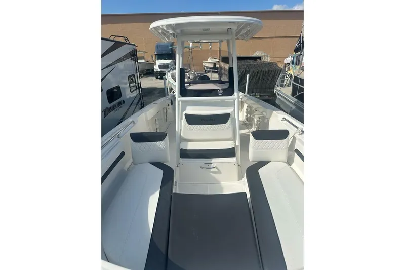 Slide: The Image of 2024 Bayliner Trophy T24CC boat interior with seating and console. - 12