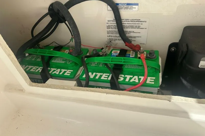 Slide: The Image of 2024 Bayliner Trophy T24CC boat battery compartment with Interstate batteries. - 16