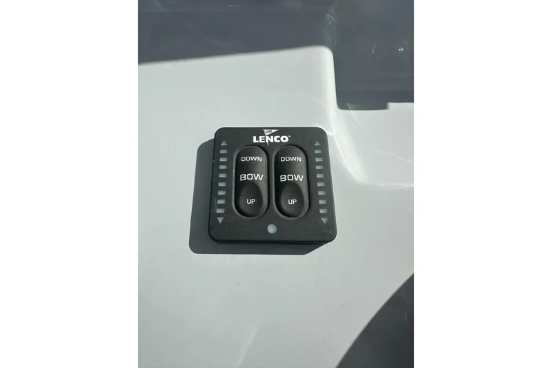 Slide: The Image of Lenco trim tab control on 2024 Bayliner Trophy T24CC boat dashboard. - 4