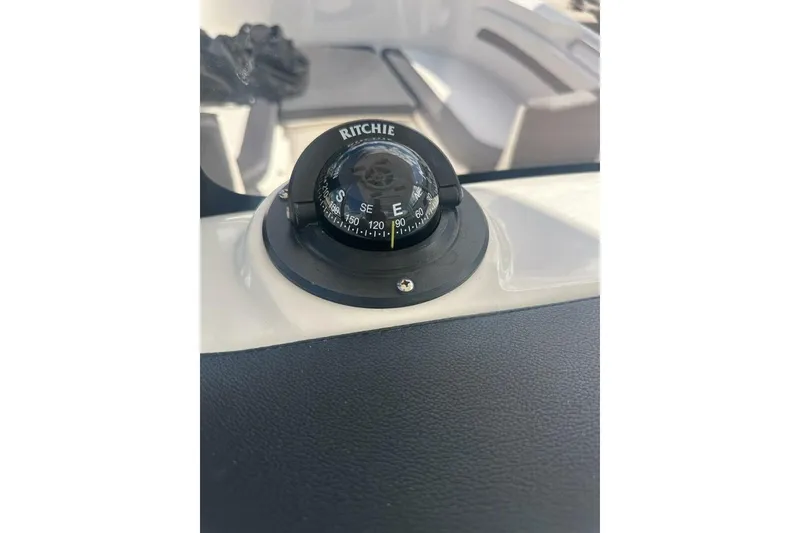 Slide: The Image of Compass on 2024 Bayliner Trophy T24CC boat dashboard, showing southeast direction. - 5