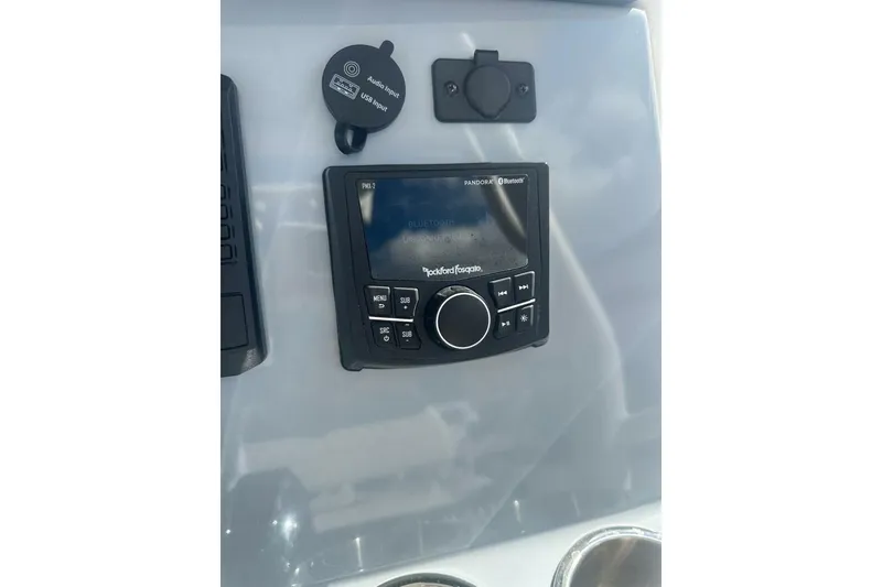 Slide: The Image of 2024 Bayliner Trophy T24CC audio system with Rockford Fosgate controls and USB input. - 7