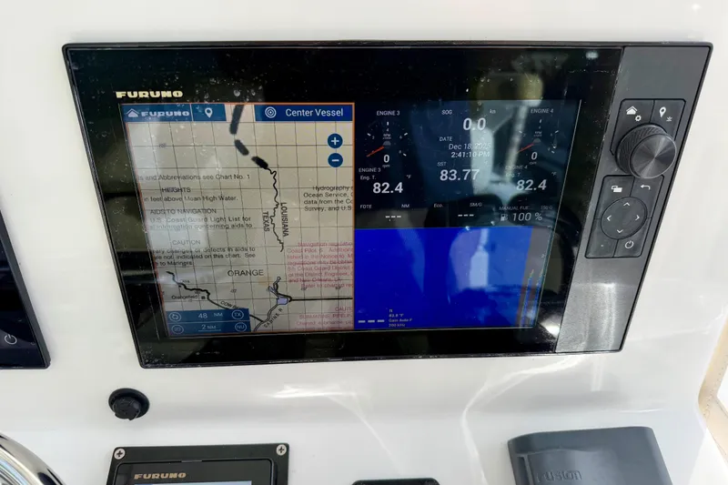 Slide: The Image of Furuno navigation display on 2025 Ocean Master 296 Center Console boat dashboard. - 11