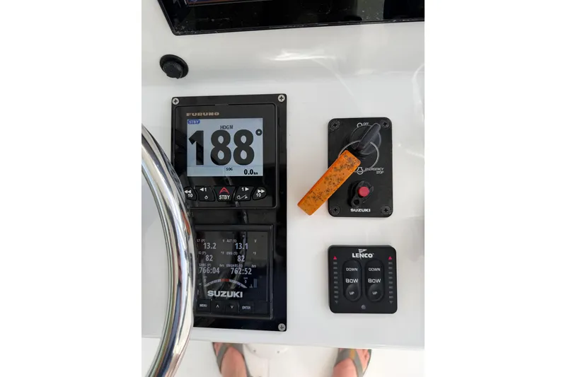 Slide: The Image of Dashboard of 2025 Ocean Master 296 Center Console with navigation and control systems. - 12