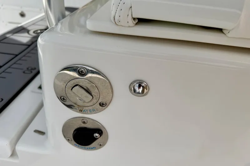 Slide: The Image of Close-up of 2025 Ocean Master 296 Center Console water and washdown controls. - 16