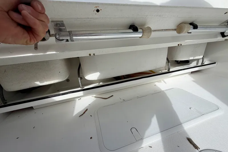 Slide: The Image of Interior view of 2025 Ocean Master 296 Center Console boat storage compartment. - 18