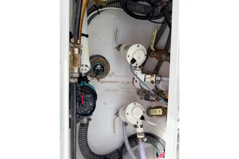 Slide: The Image of Bilge area of 2025 Ocean Master 296 Center Console with pumps and wiring. - 20