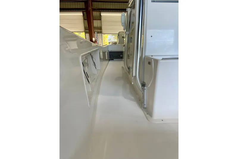 Slide: The Image of 2025 Ocean Master 296 Center Console interior view in a boatyard. - 29