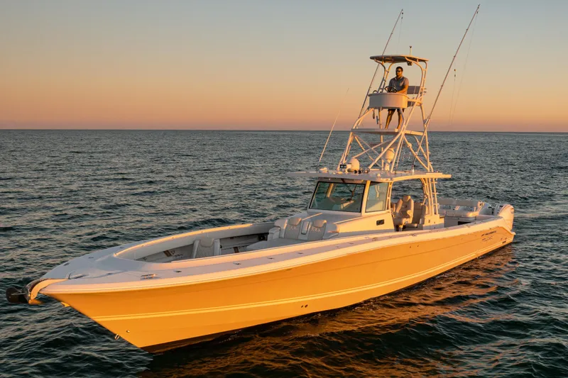 The Image of 2018 HCB 53 Suenos RXV boat on open water at sunset. - 0